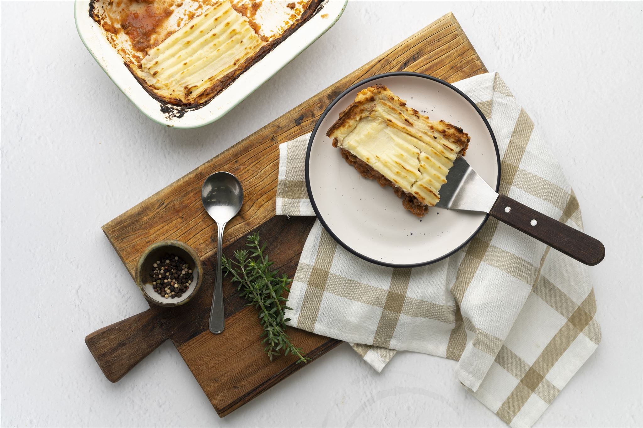 A mouthwatering snapshot of our Shepherd's Pie, brimming with savory flavors and topped with golden cheese, perfect for a family meal