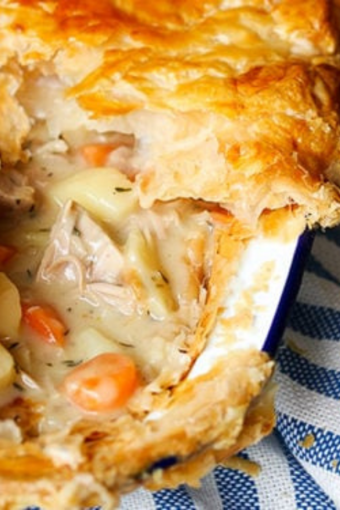 A mouthwatering snapshot of our homemade Chicken & Vege Pie, featuring a creamy filling and golden pastry crust, perfect for a family meal